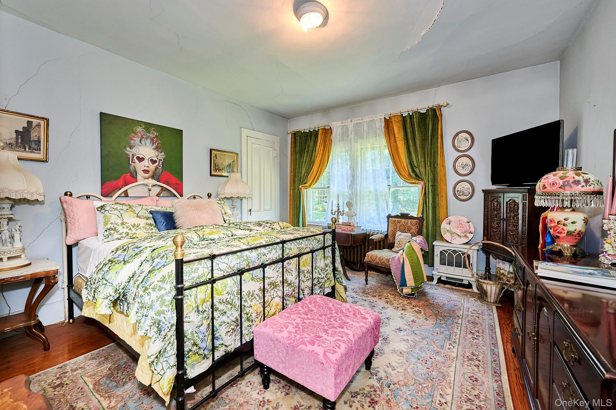 22 Proctor Road Eldred, NY 12732 - Photo 27 of 50 a bedroom with furniture and a flat screen tv