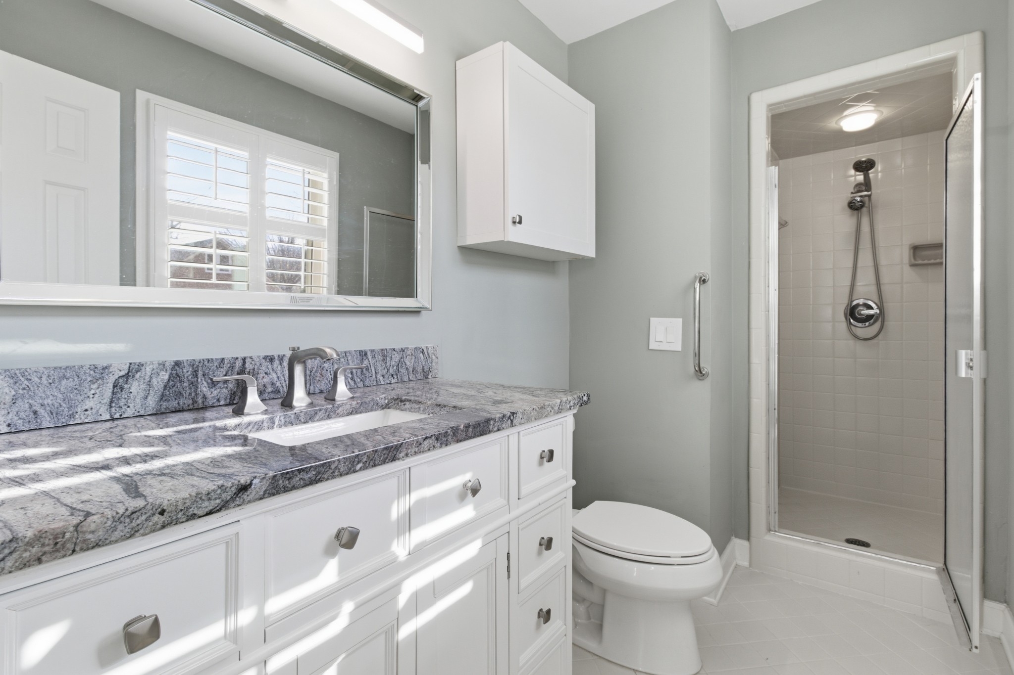 707 Banner Drive Murfreesboro, TN 37129 - Photo 14 of 46 a bathroom with a granite countertop sink toilet and shower