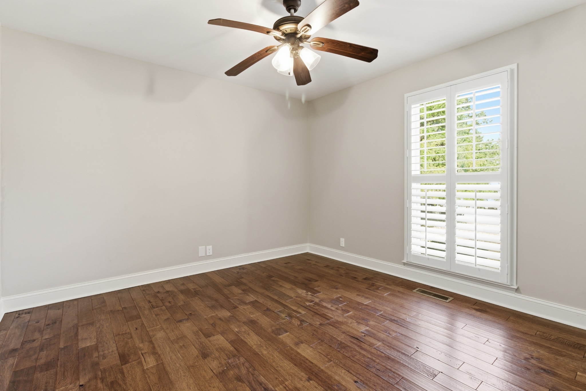 707 Banner Drive Murfreesboro, TN 37129 - Photo 16 of 46 wooden floor in an empty room with a window