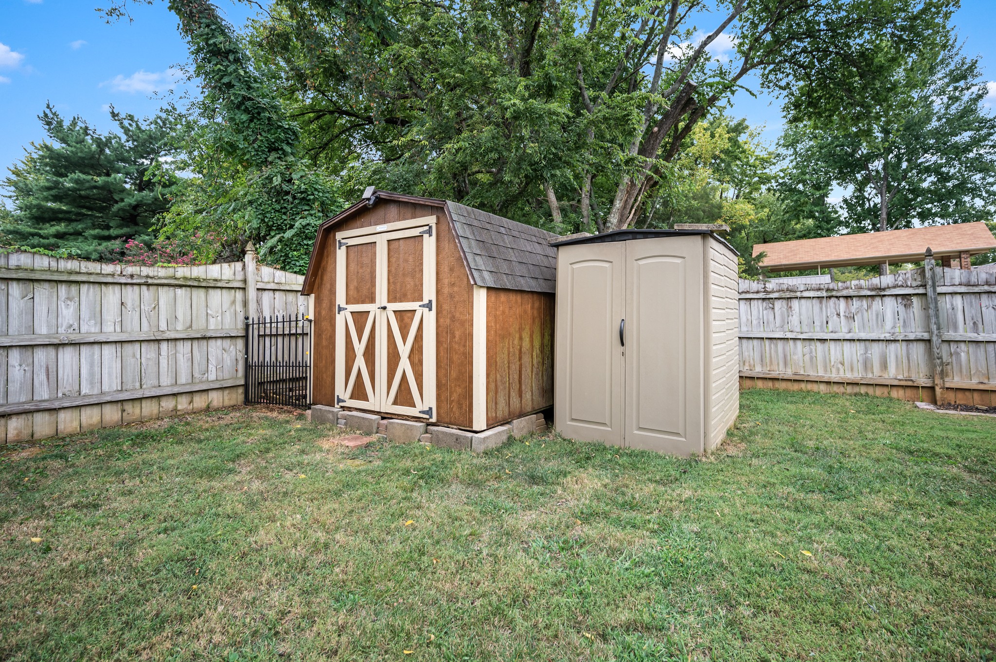 707 Banner Drive Murfreesboro, TN 37129 - Photo 46 of 46 a backyard of a house with a small barn and wooden fence