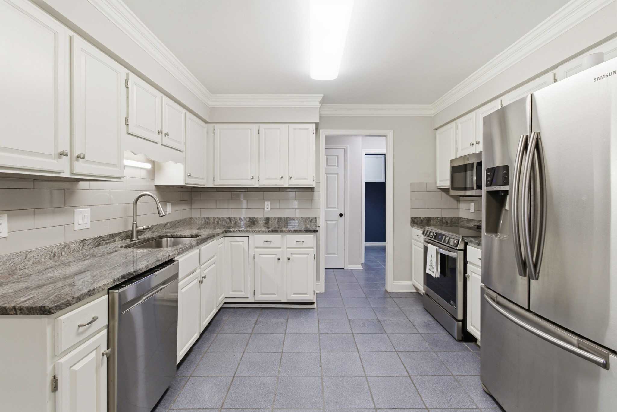 707 Banner Drive Murfreesboro, TN 37129 - Photo 9 of 46 a kitchen with stainless steel appliances granite countertop a refrigerator sink and cabinets