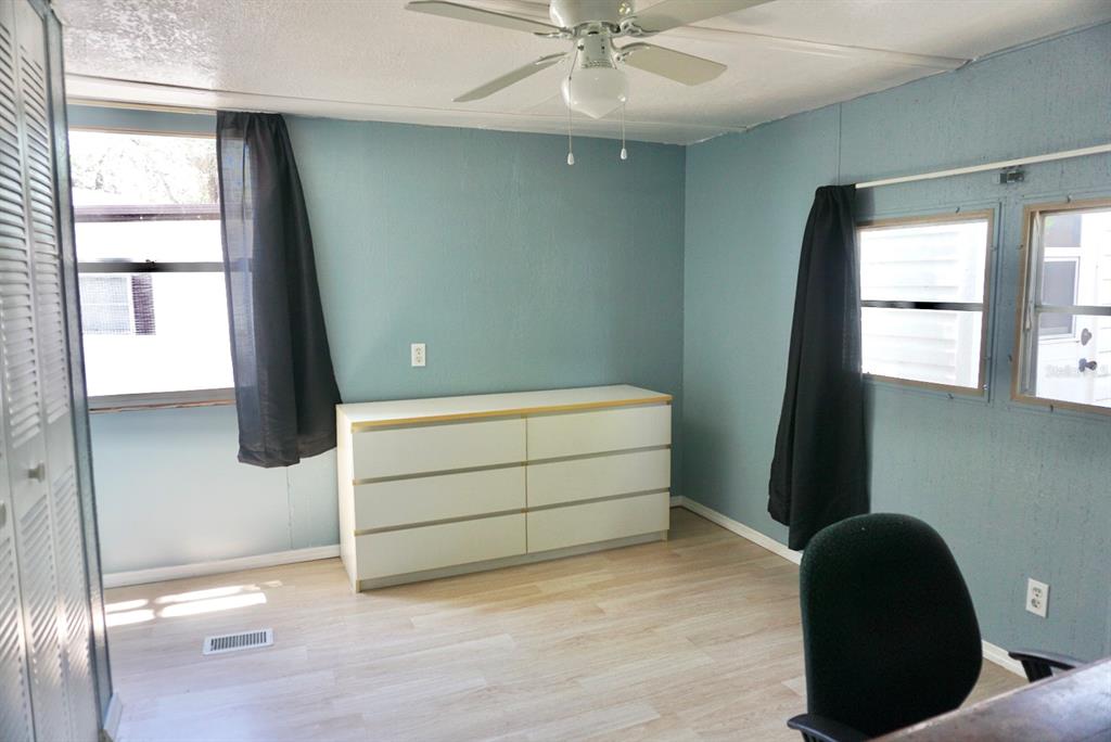 980 7th Street Northwest, Unit 71 Largo, FL 33770 - Photo 14 of 23 a room with window and a ceiling fan