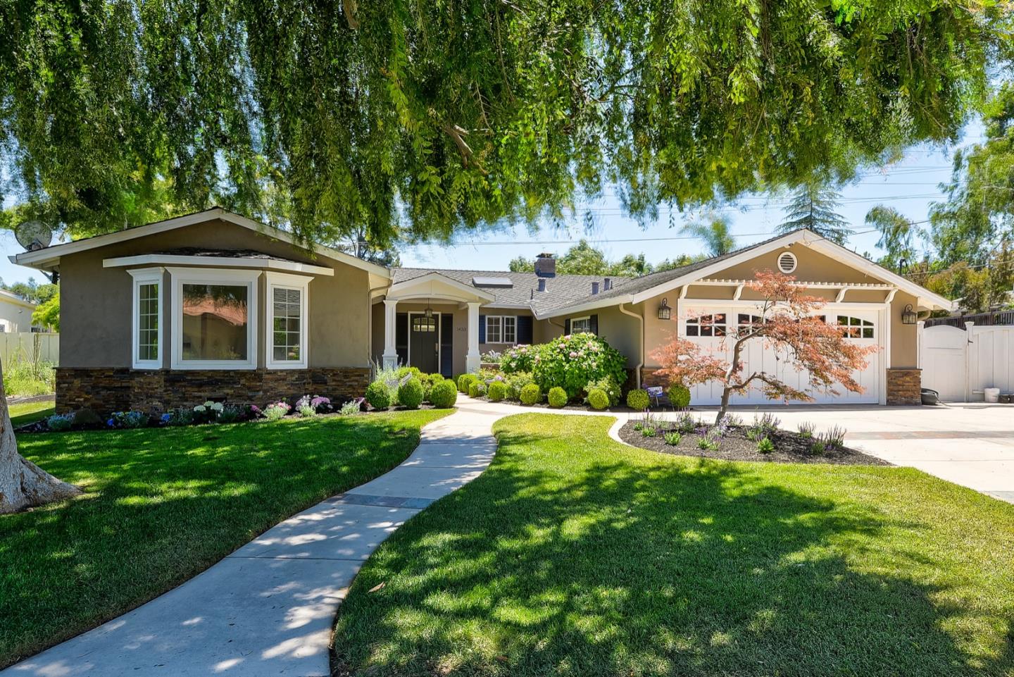 1433 Brookmill Road Los Altos, CA 94024 - Photo 1 of 39 a front view of a house with a yard and porch