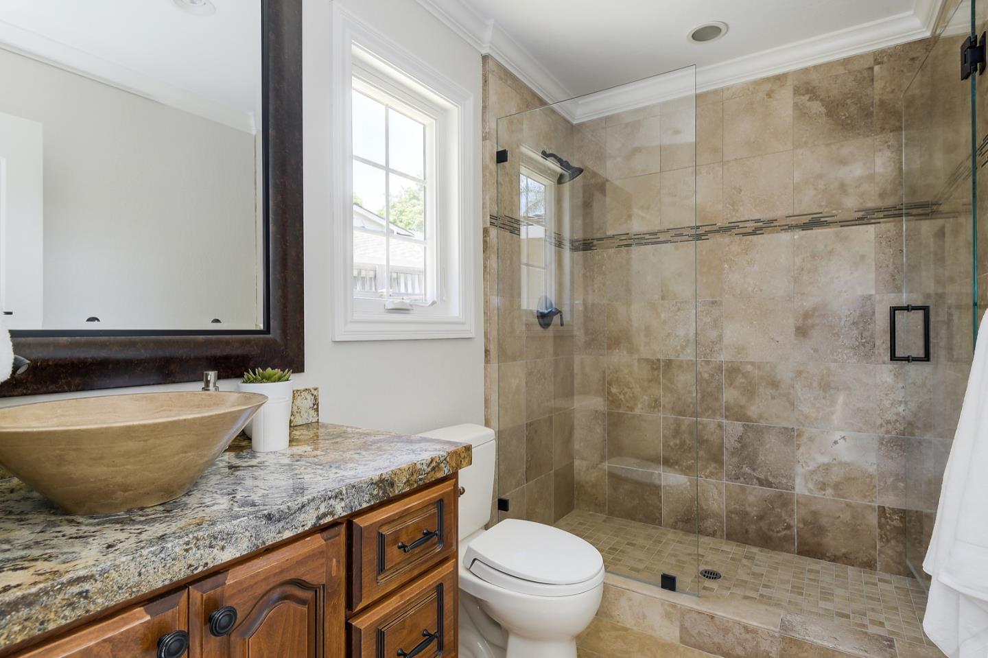 1433 Brookmill Road Los Altos, CA 94024 - Photo 18 of 39 a bathroom with a granite countertop sink a toilet and shower