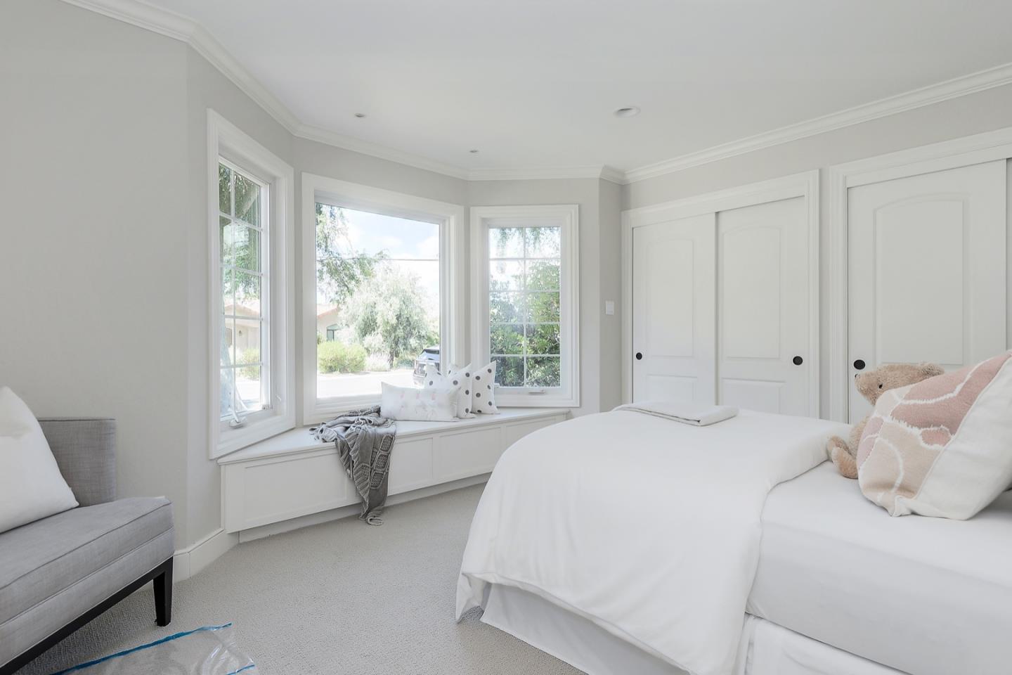 1433 Brookmill Road Los Altos, CA 94024 - Photo 21 of 39 a bedroom with a large bed and a couch