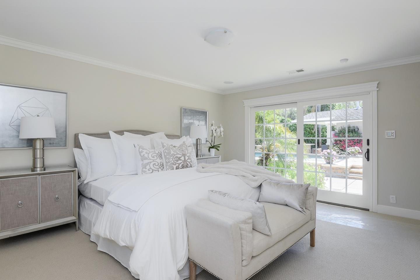 1433 Brookmill Road Los Altos, CA 94024 - Photo 24 of 39 a spacious bedroom with a bed and a large window