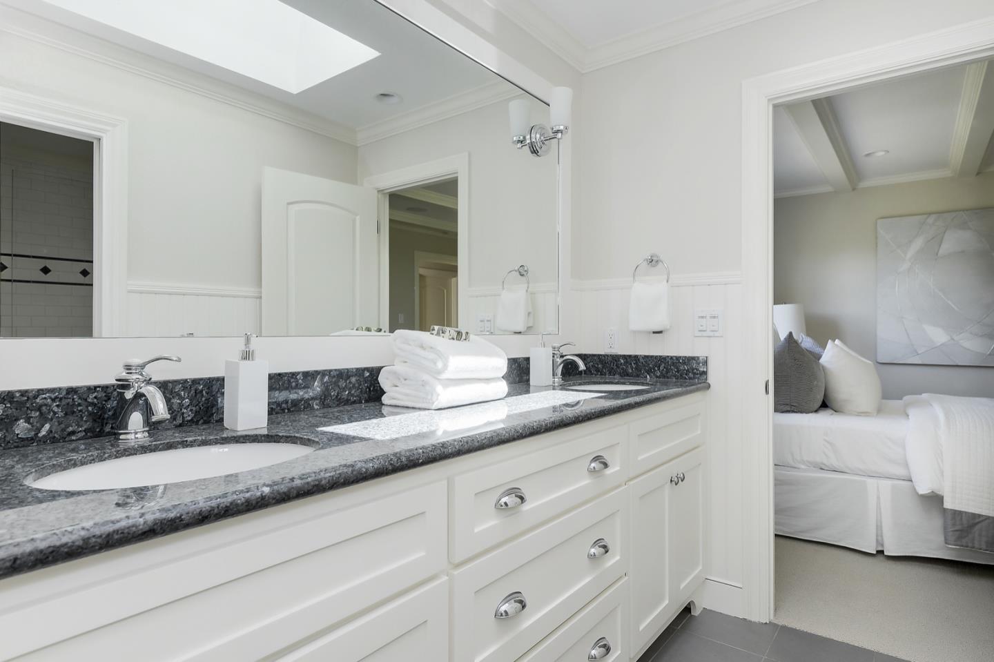 1433 Brookmill Road Los Altos, CA 94024 - Photo 26 of 39 a bathroom with double vanity sinks a vanity and mirrors