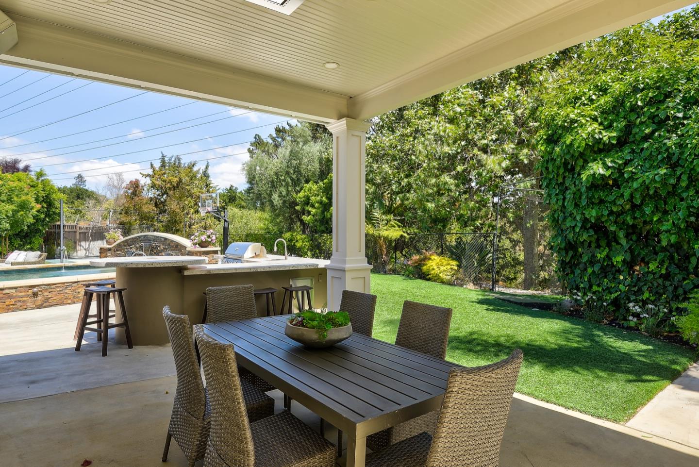1433 Brookmill Road Los Altos, CA 94024 - Photo 30 of 39 a view of a patio with a table chairs and a backyard
