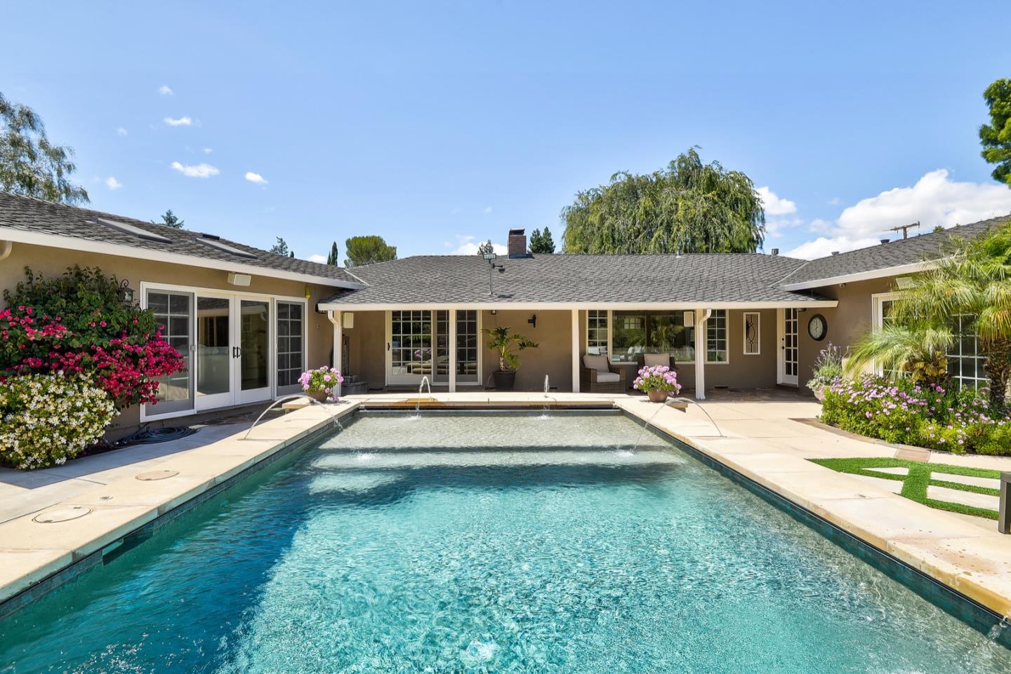 1433 Brookmill Road Los Altos, CA 94024 - Photo 36 of 39 front view of a house with a yard and potted plants