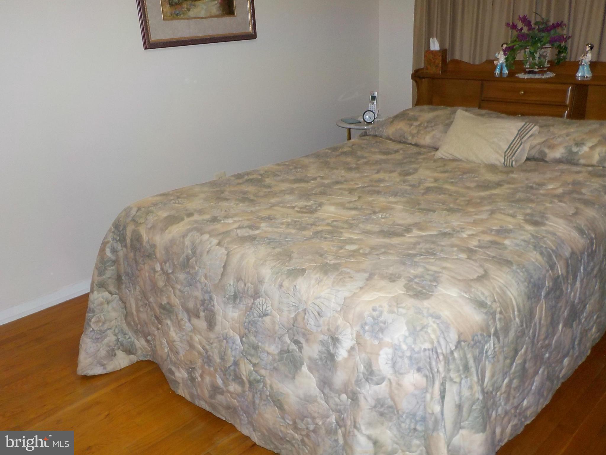 944 Middleborough Road Baltimore, MD 21221 - Photo 12 of 30 a bedroom with a bed and a couch
