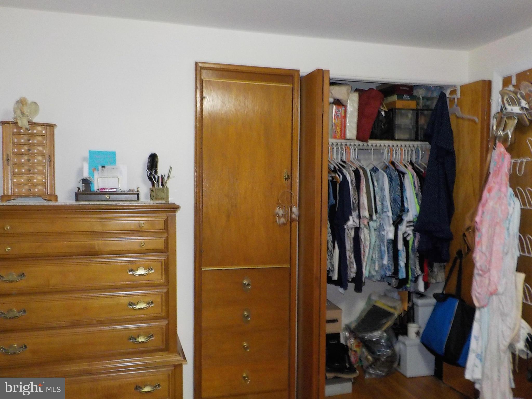 944 Middleborough Road Baltimore, MD 21221 - Photo 13 of 30 a view of walk in closet with clothes and shoes