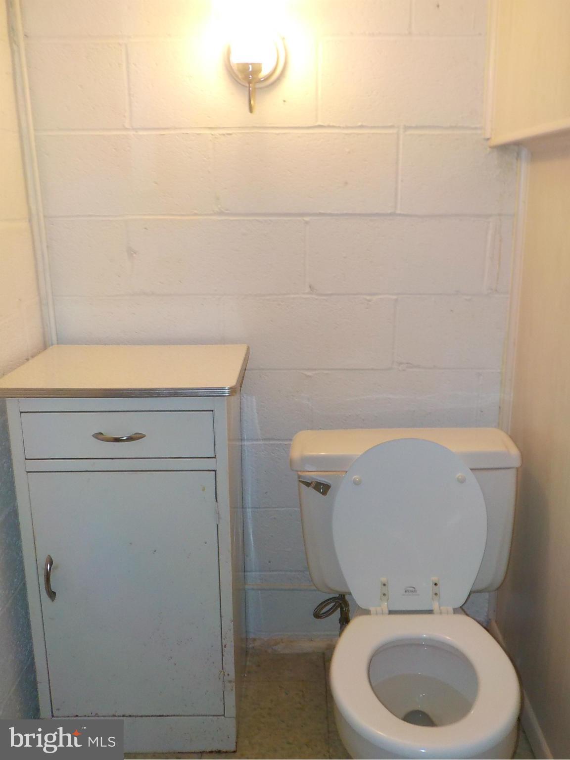 944 Middleborough Road Baltimore, MD 21221 - Photo 25 of 30 a bathroom with a toilet and a shower
