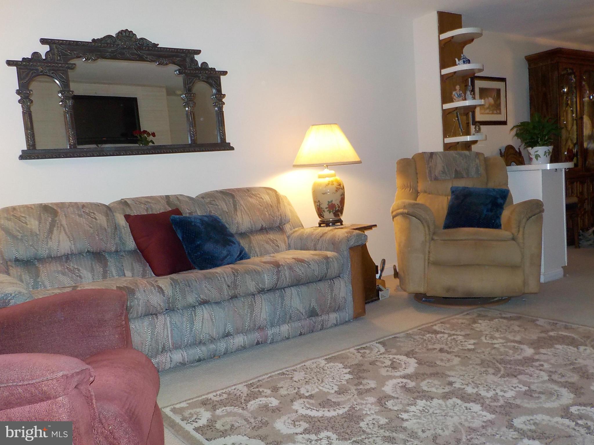 944 Middleborough Road Baltimore, MD 21221 - Photo 5 of 30 a living room with furniture and a flat screen tv