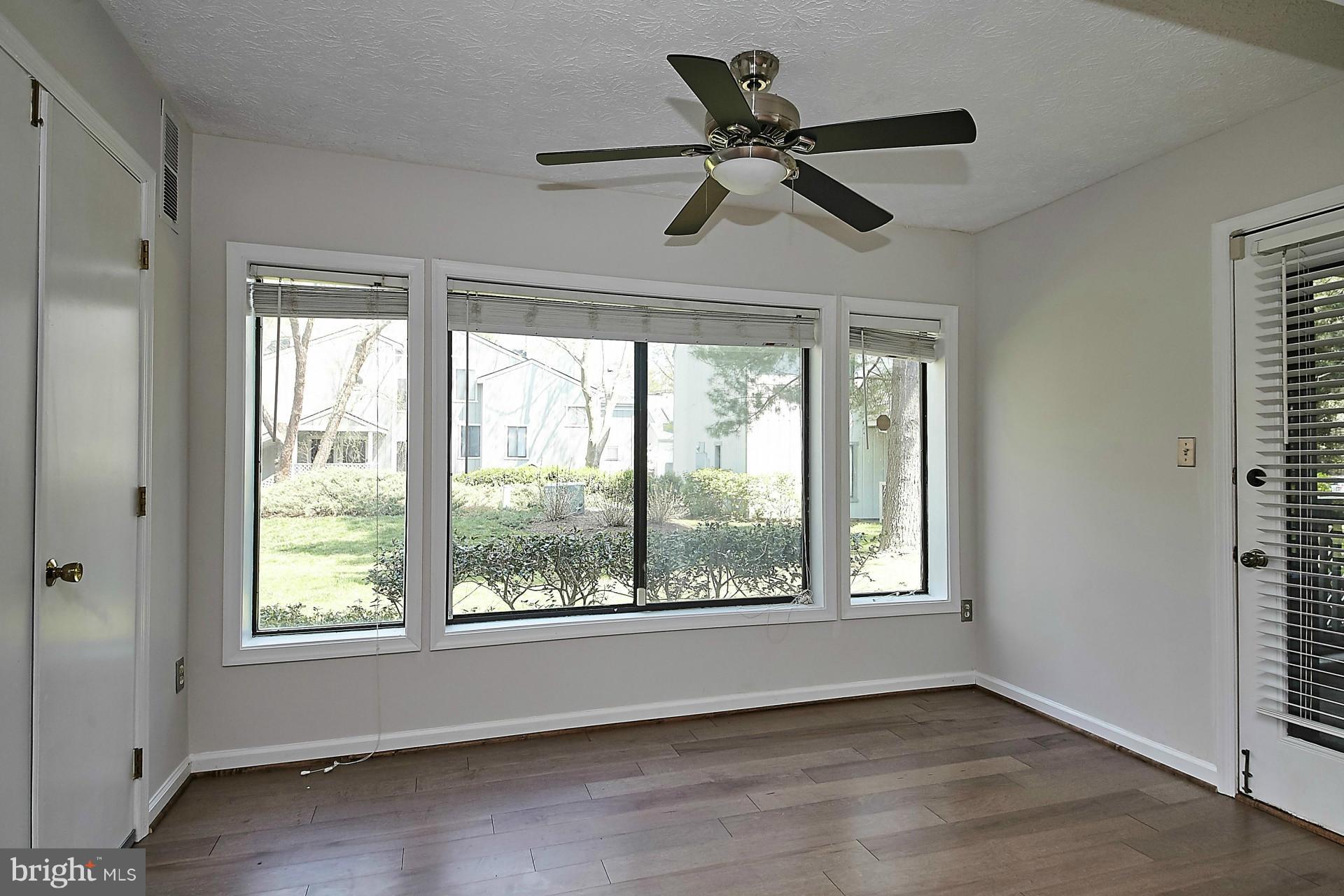 2265 Hunter's Run Drive, Unit 2265 Reston, VA 20191 - Photo 16 of 30 Living Room/Sun Room