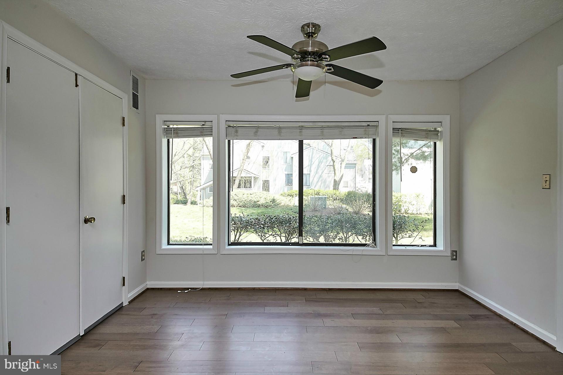 2265 Hunter's Run Drive, Unit 2265 Reston, VA 20191 - Photo 18 of 30 Living Room/Sun Room