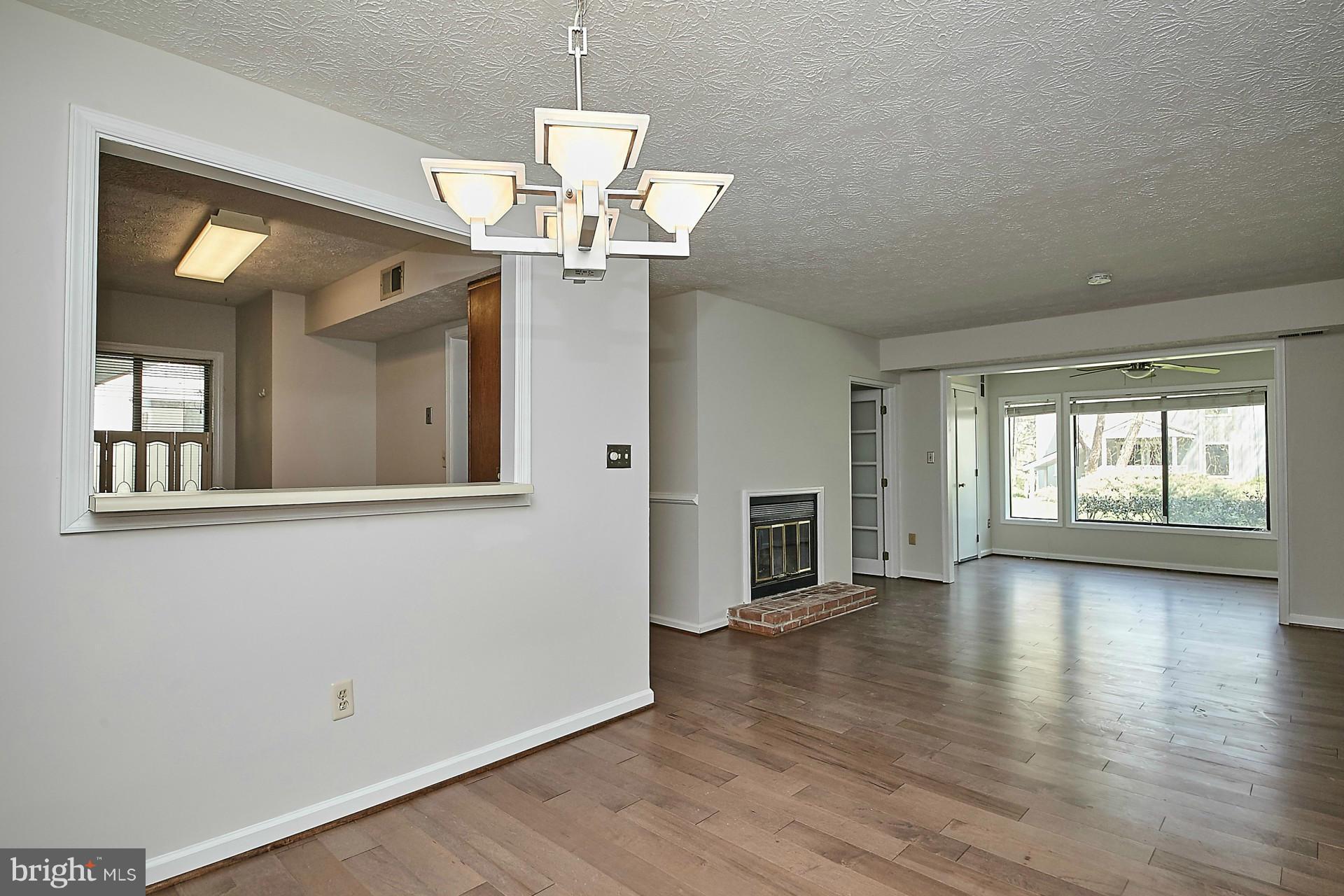 2265 Hunter's Run Drive, Unit 2265 Reston, VA 20191 - Photo 8 of 30 Dining Room to Family Room