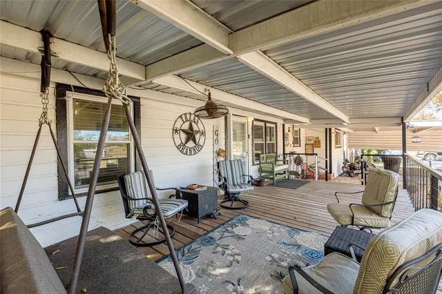 a view of a patio with table and chairs