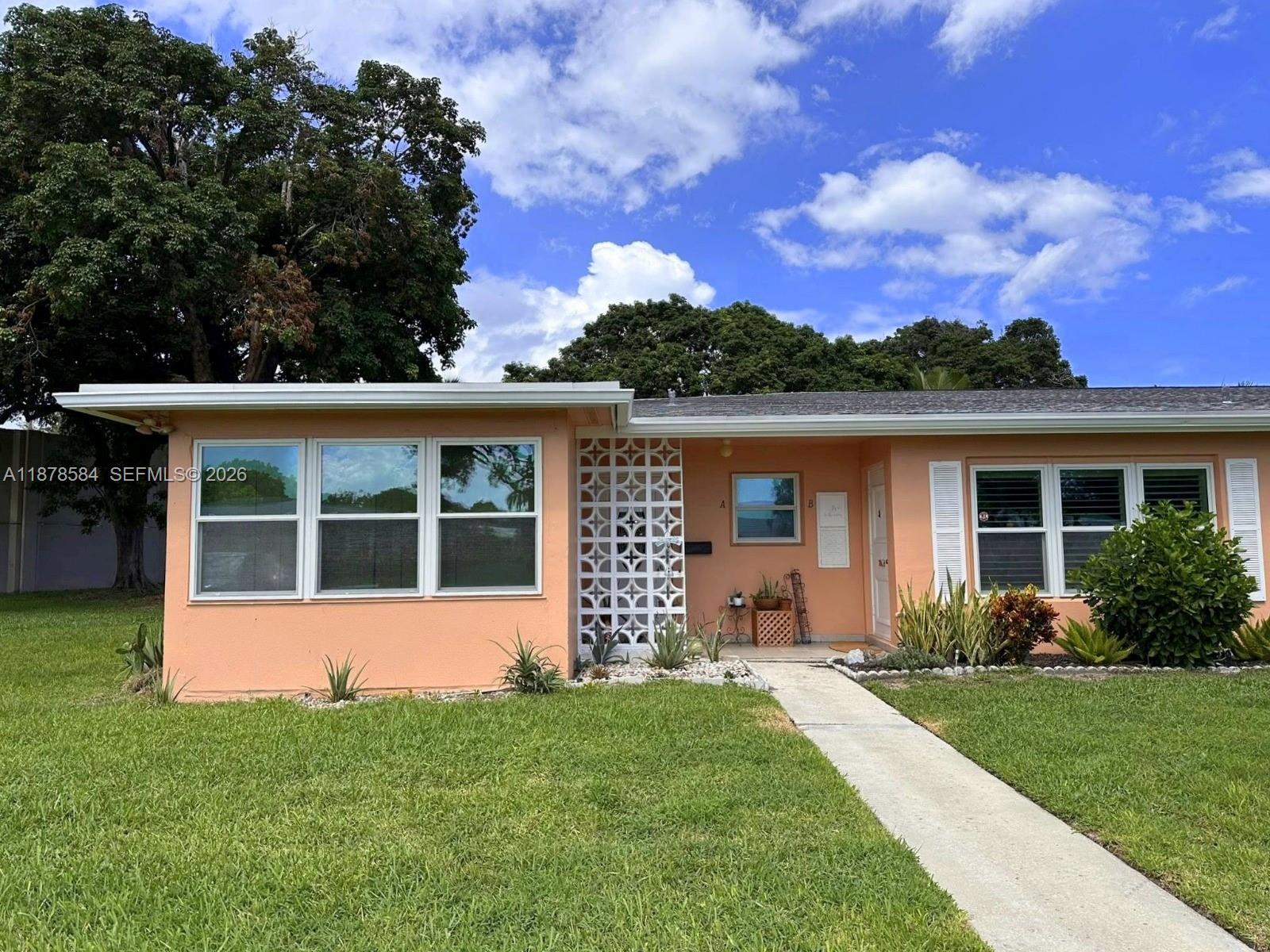 285 North High Point, Unit A Boynton Beach, FL 33435 - Photo 1 of 32 front view of a house with a yard