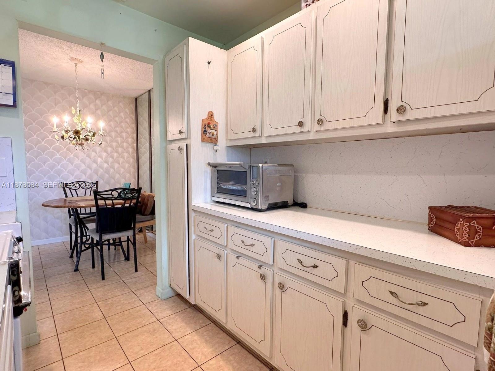 285 North High Point, Unit A Boynton Beach, FL 33435 - Photo 11 of 32 a kitchen with cabinets and appliances