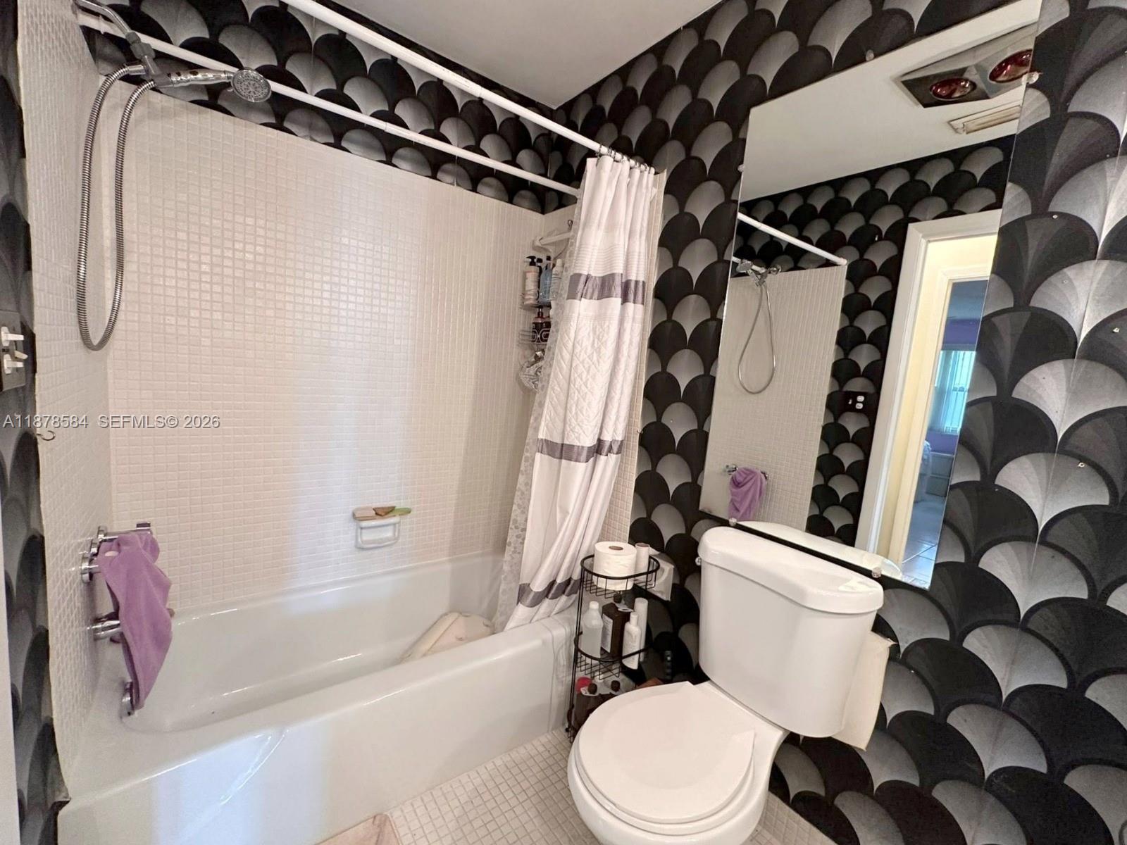 285 North High Point, Unit A Boynton Beach, FL 33435 - Photo 21 of 32 a white toilet sitting next to a bath tub