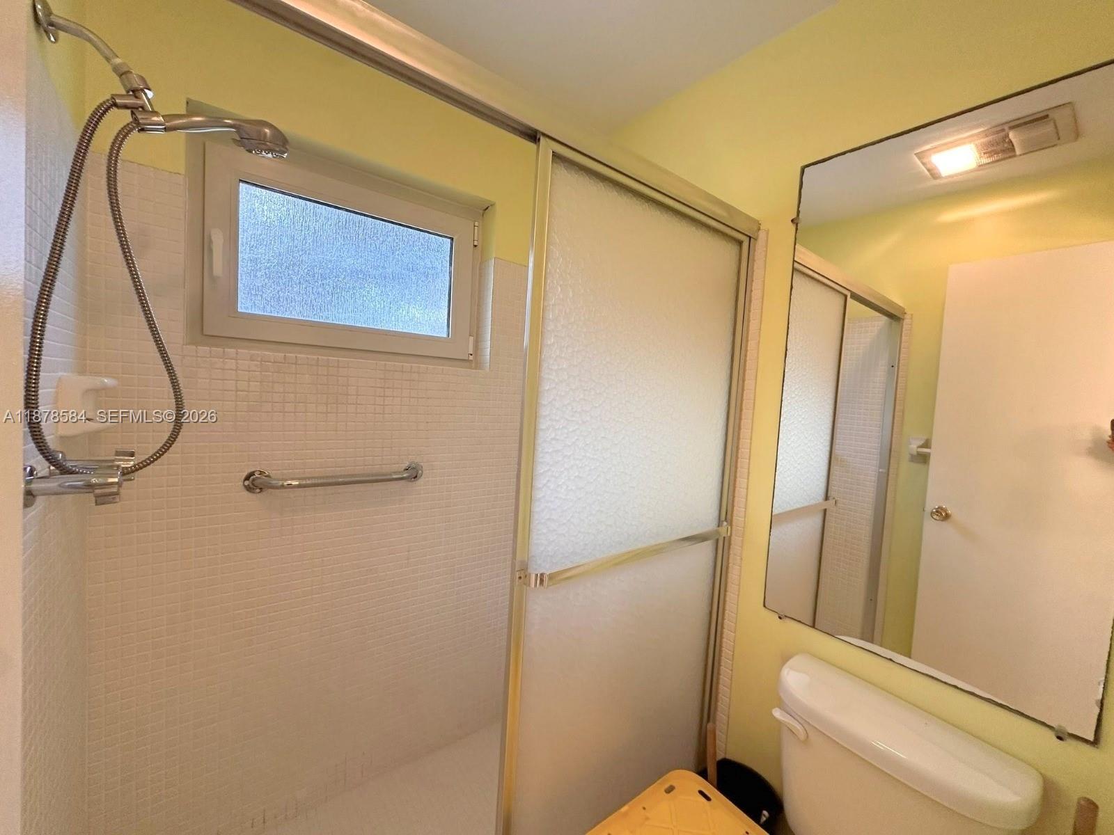285 North High Point, Unit A Boynton Beach, FL 33435 - Photo 23 of 32 a bathroom with a shower a toilet and a sink