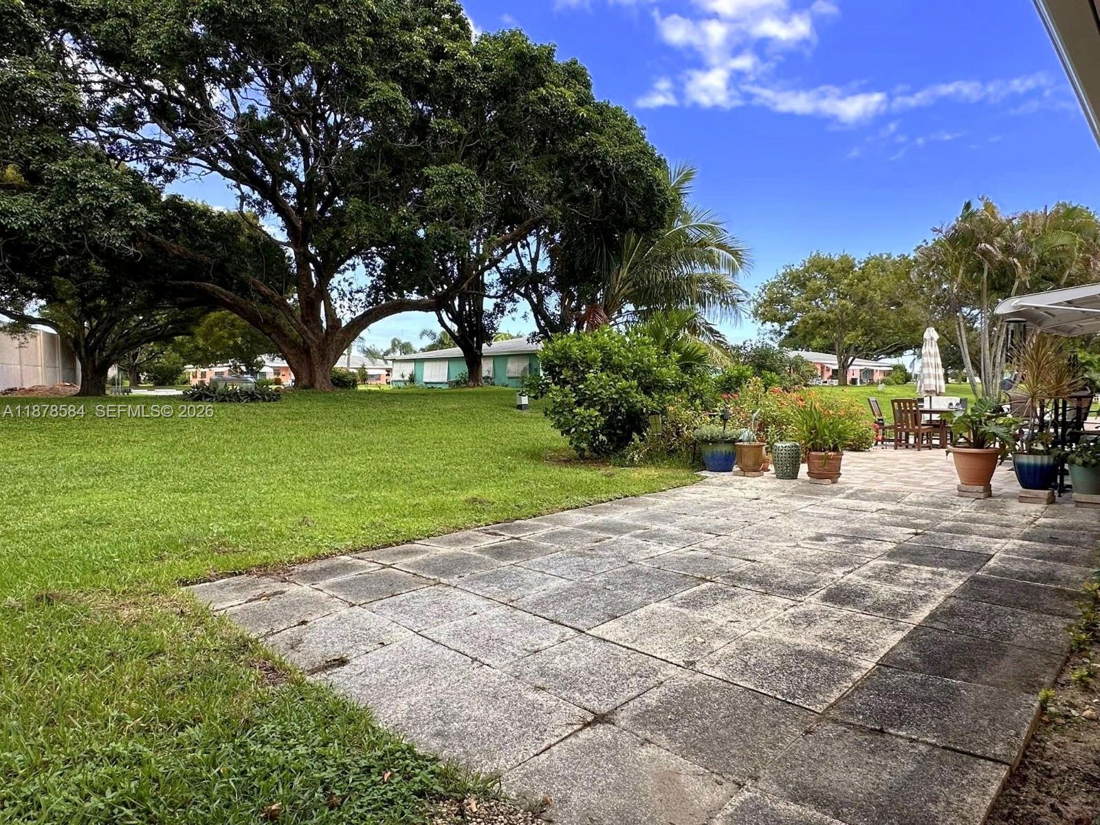 285 North High Point, Unit A Boynton Beach, FL 33435 - Photo 26 of 32 a view of a park with large trees