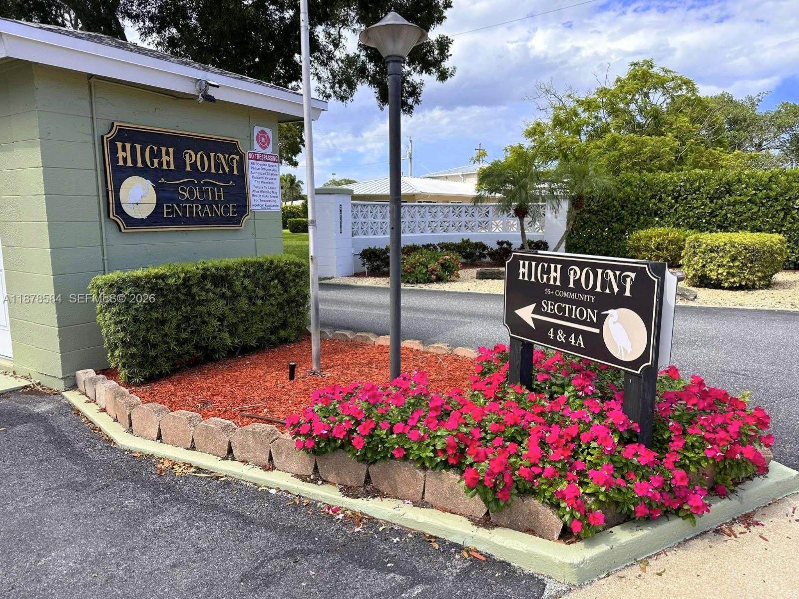 285 North High Point, Unit A Boynton Beach, FL 33435 - Photo 27 of 32 a sign board with buildings in the background