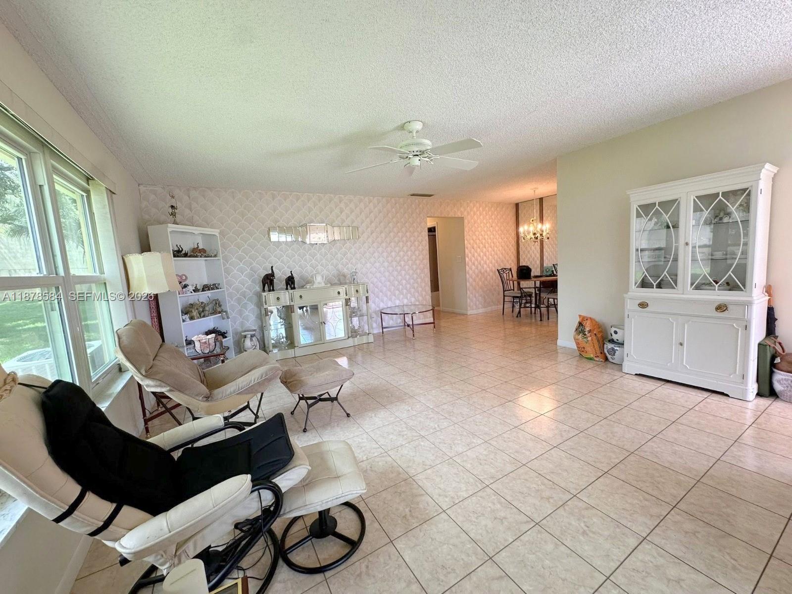 285 North High Point, Unit A Boynton Beach, FL 33435 - Photo 5 of 32 a living room with furniture and wooden floor
