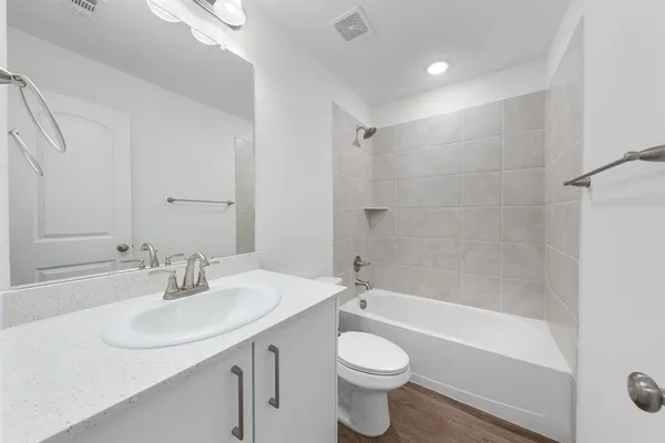 a bathroom with a sink a toilet and a bathtub