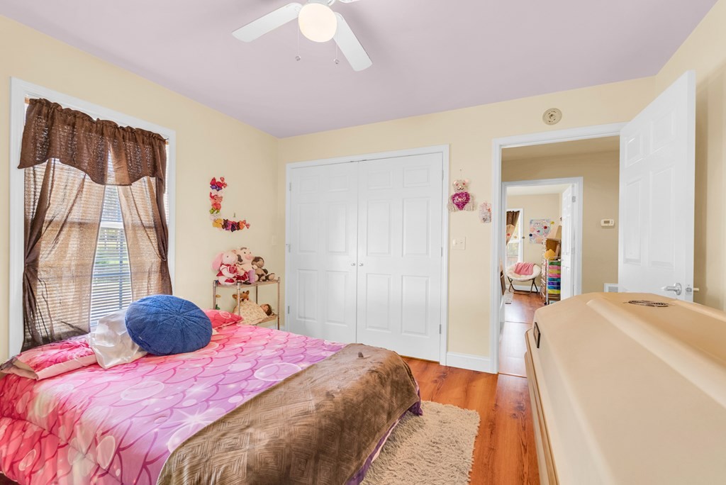 908 River Chase Trail Clarkrange, TN 38553 - Photo 14 of 46 a bedroom with a bed and a chandelier