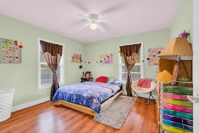 a bedroom with a bed and dresser