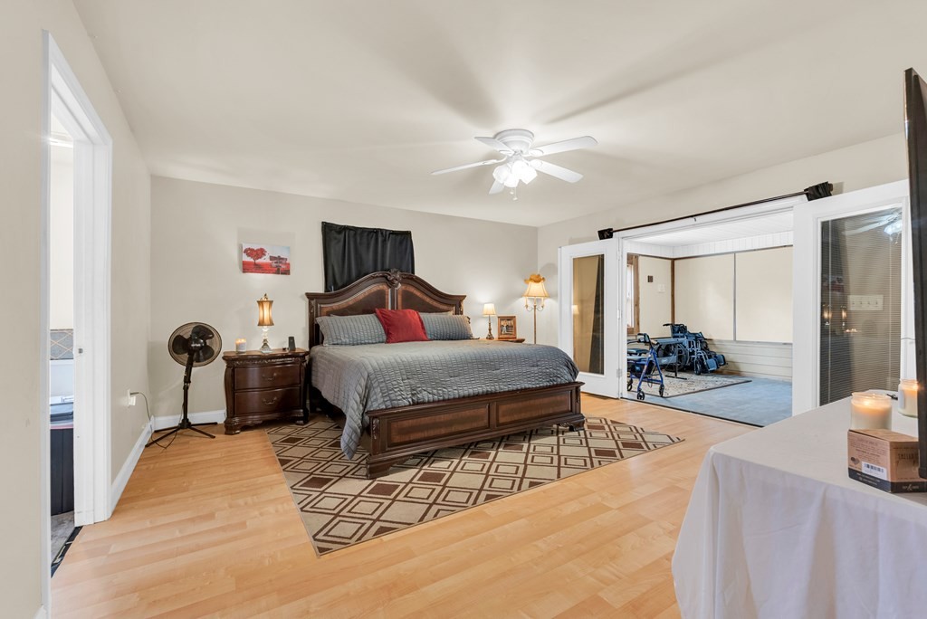908 River Chase Trail Clarkrange, TN 38553 - Photo 17 of 46 a bedroom with a bed and a large mirror with a bookshelf