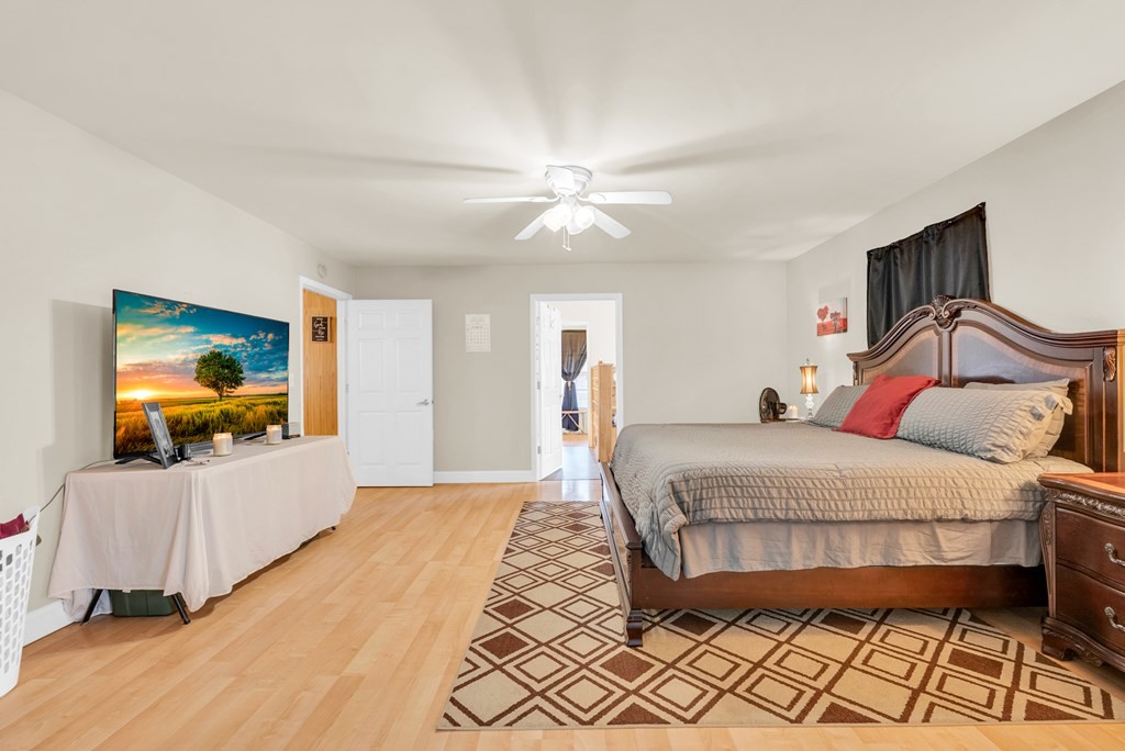 908 River Chase Trail Clarkrange, TN 38553 - Photo 18 of 46 a bedroom with a bed and a flat screen tv