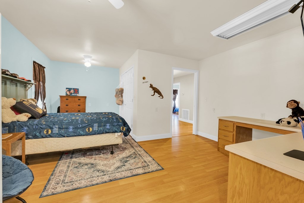 908 River Chase Trail Clarkrange, TN 38553 - Photo 20 of 46 a bedroom with a bed and wooden floor