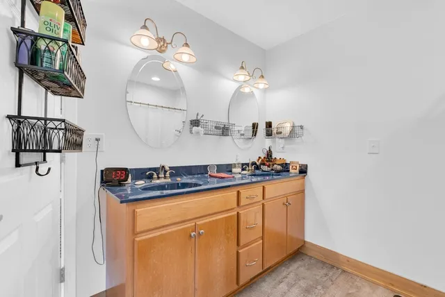 a kitchen with a sink and cabinets