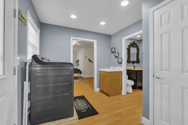 a view of walk in closet and bedroom