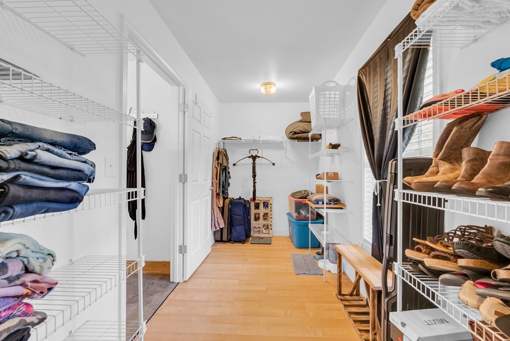 908 River Chase Trail Clarkrange, TN 38553 - Photo 26 of 46 a view of walk in closet with clothes and shoes