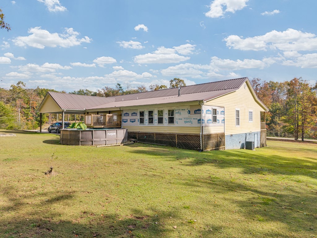 908 River Chase Trail Clarkrange, TN 38553 - Photo 33 of 46 a view of swimming pool with lawn chairs and large trees
