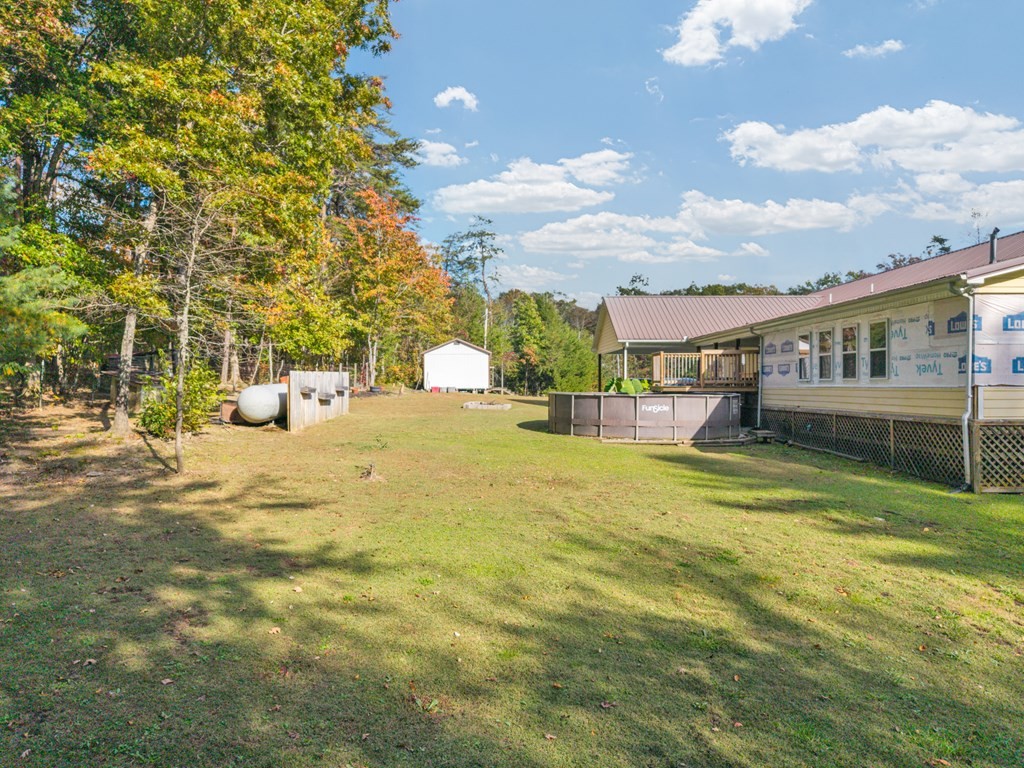 908 River Chase Trail Clarkrange, TN 38553 - Photo 34 of 46 a view of swimming pool with a garden and trees