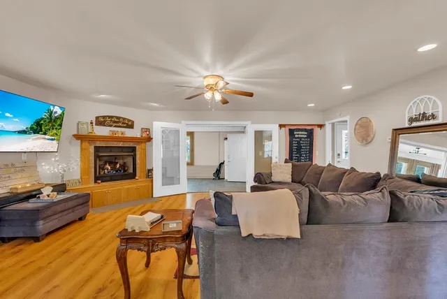 a living room with furniture fireplace and a fireplace
