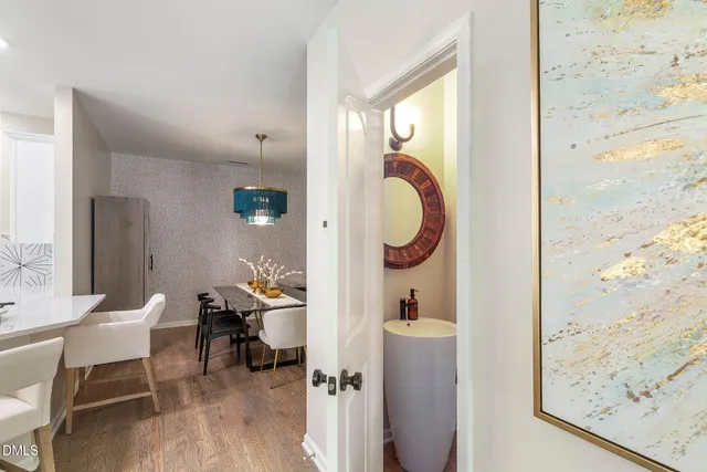 a living room with furniture and a mirror