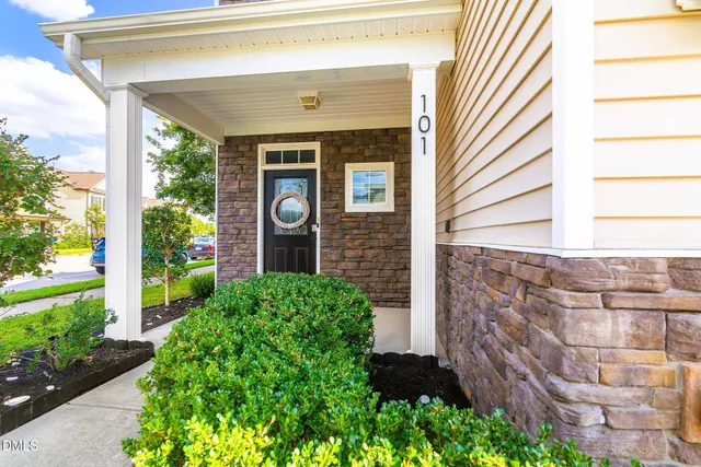 a front view of a house with garden