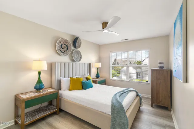 a bedroom with a bed and window