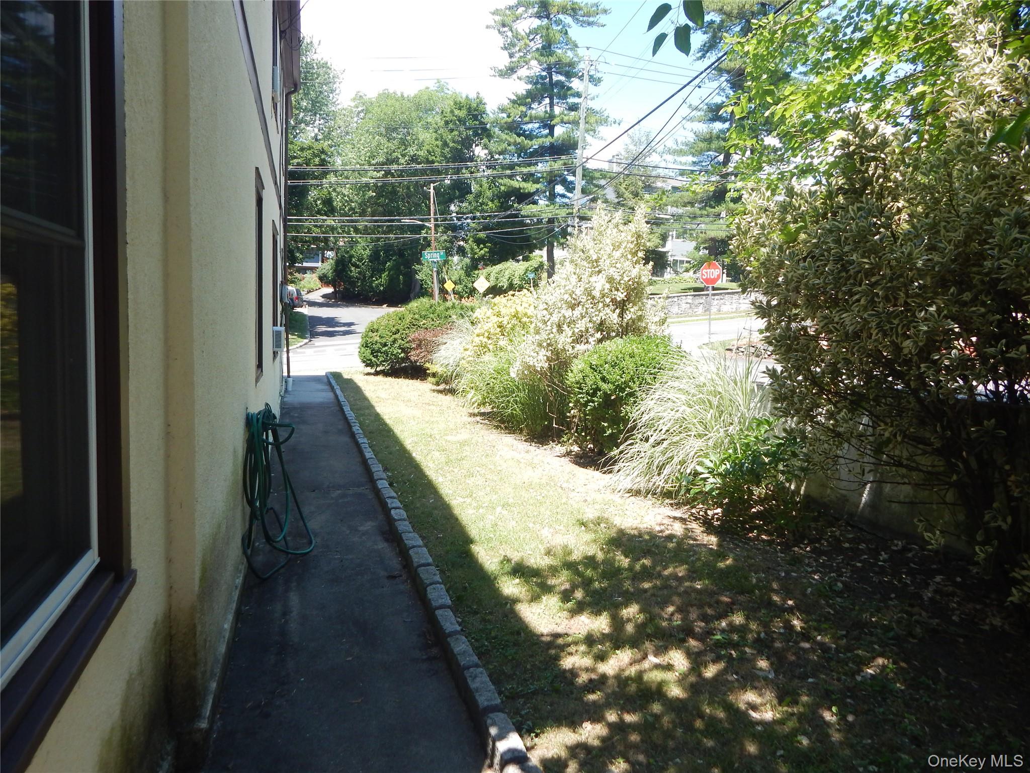 321 Spring Street Ossining, NY 10562 - Photo 16 of 18 Side yard/walk way. Driveway, not pictured, is on the other side of the house.