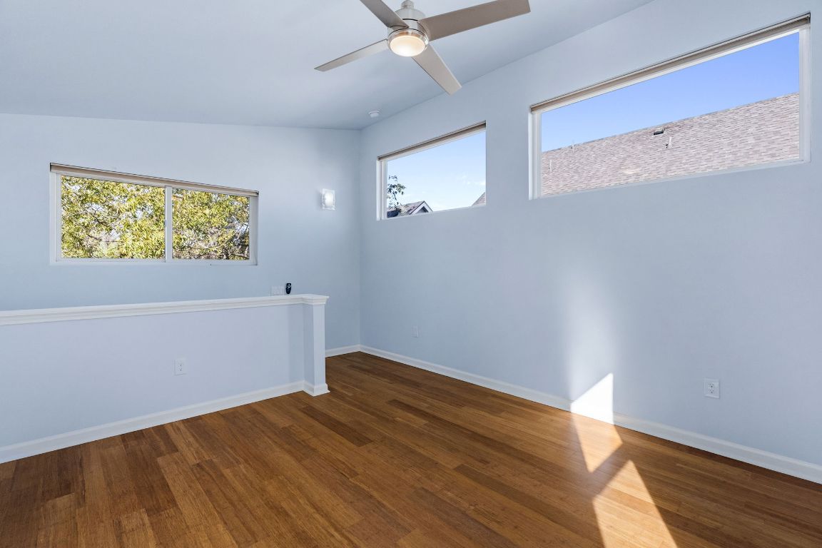 1309 Singleton Avenue, Unit 2 Austin, TX 78702 - Photo 18 of 25 a view of room with wooden floor and window