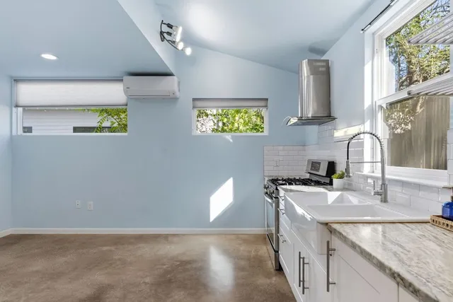 a view of an empty room with a window