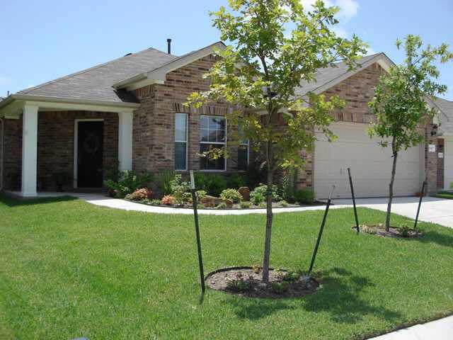 1840 Stone Rim Loop Buda, TX 78610 - Photo 1 of 1 a view of a house with a backyard
