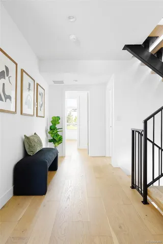 a bedroom with a bed couch and window