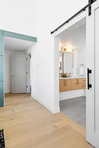a bathroom with a toilet a sink and shower