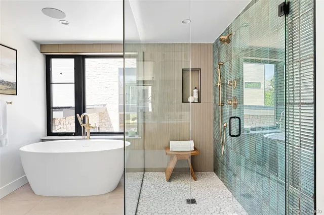 a bathroom with a tub and a window